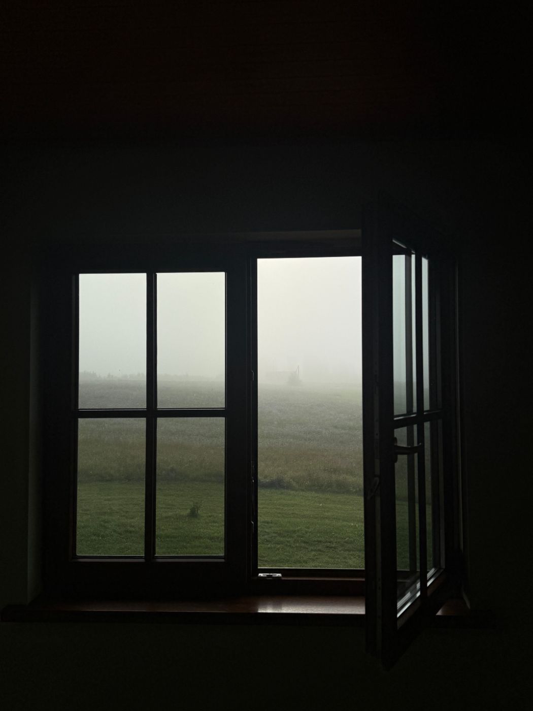 A window looking out onto fog
