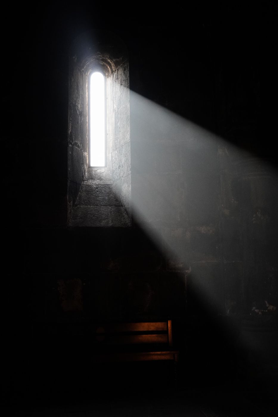 Light falling through a narrow stone window
