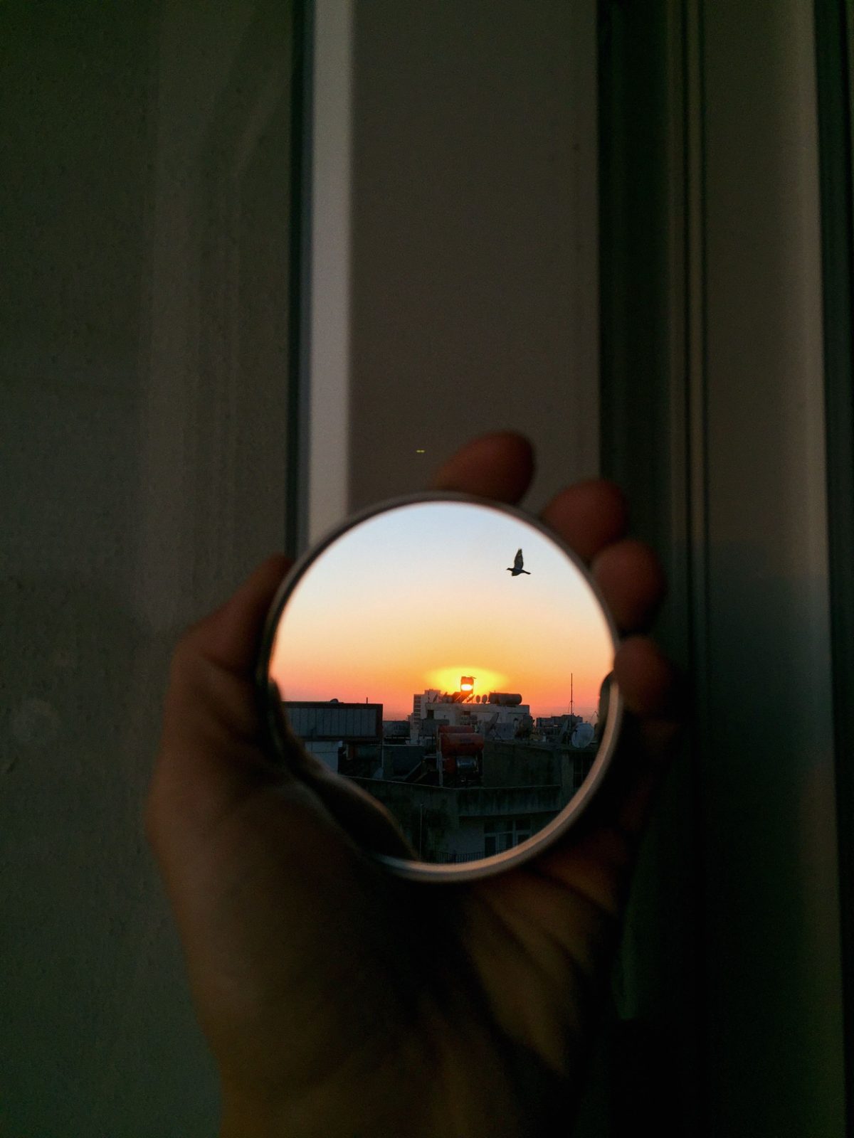 A sunset reflected in a mirror
